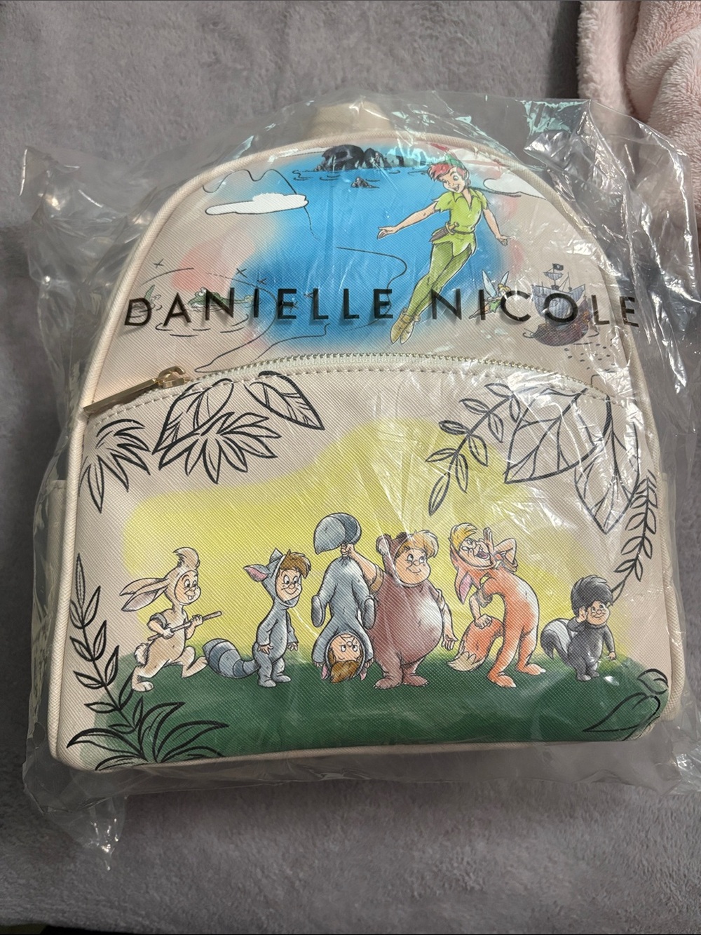 Danielle Nicole Cream Peter Pan Character Mini Backpack with Multicolor Artwork